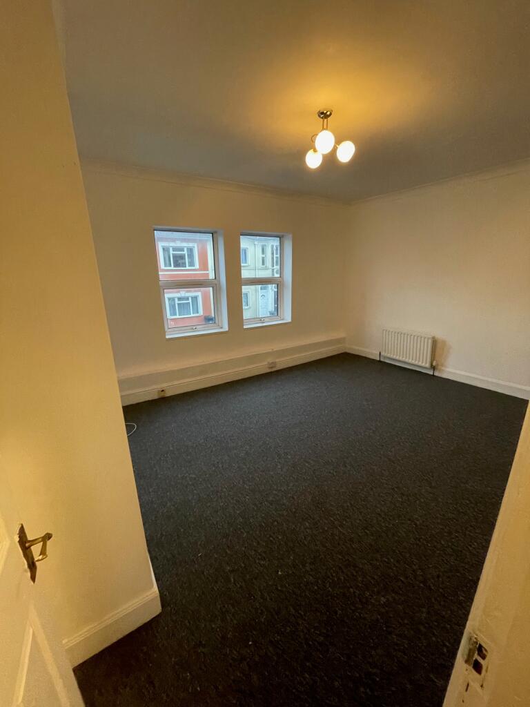 A spacious living room with ample natural light...