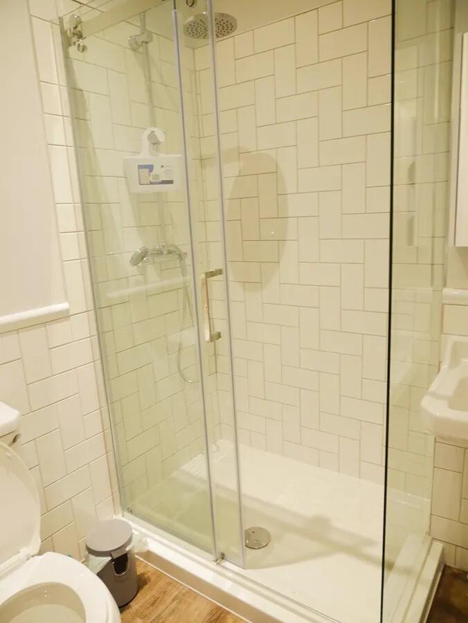 Bright and modern bathroom featuring a spacious...