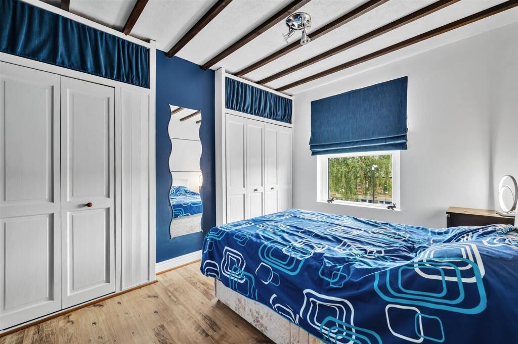 Bedroom Two to window and wardrobes.jpg