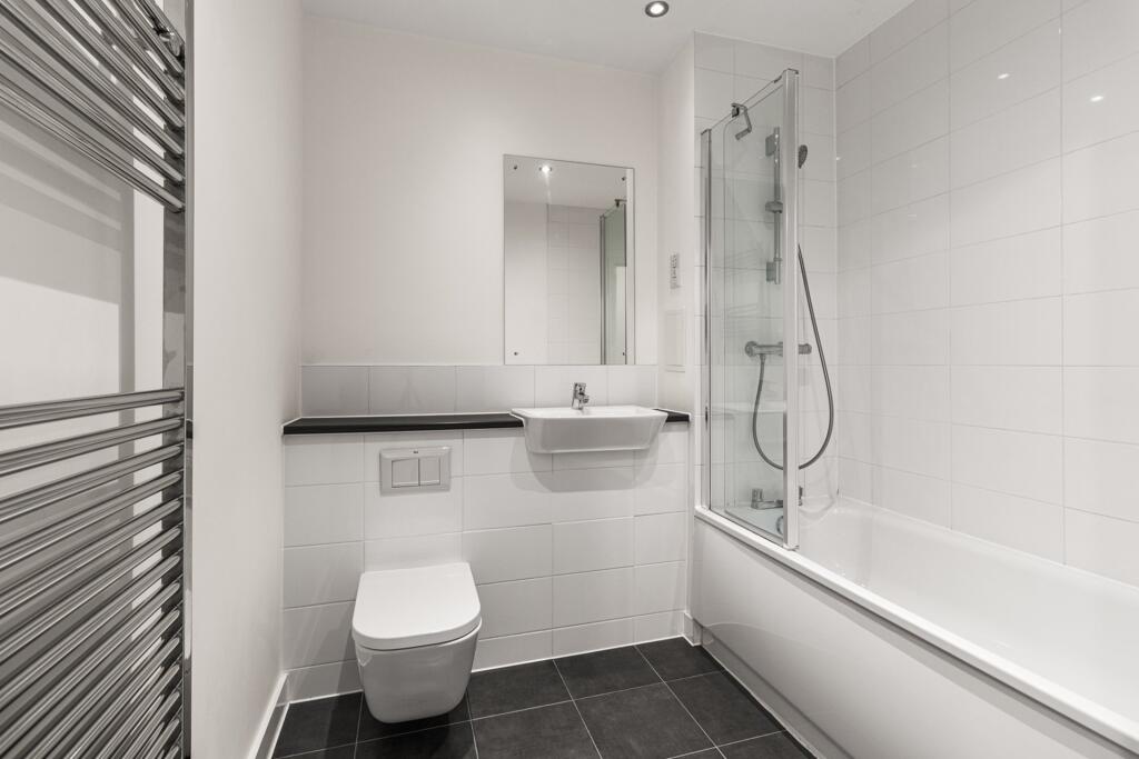 Immerse yourself in luxury with this sleek and modern bathroom design.