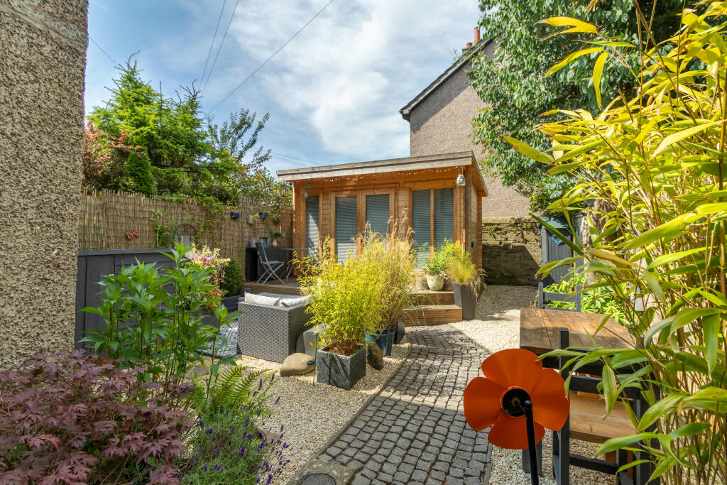 Rear Garden And Summer House