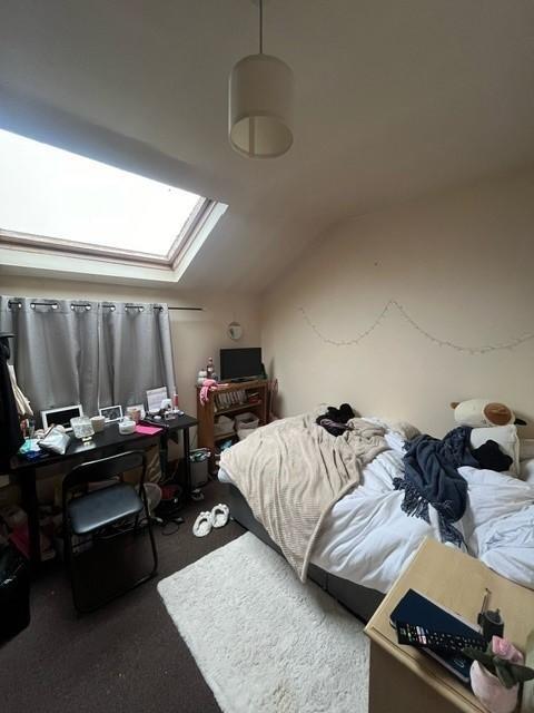 A cozy bedroom with natural light streaming thr...