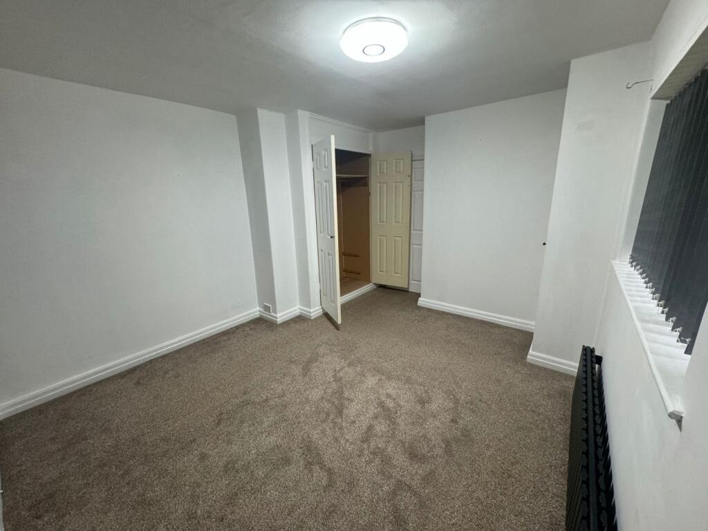 Bright and spacious living area with a clean, n...