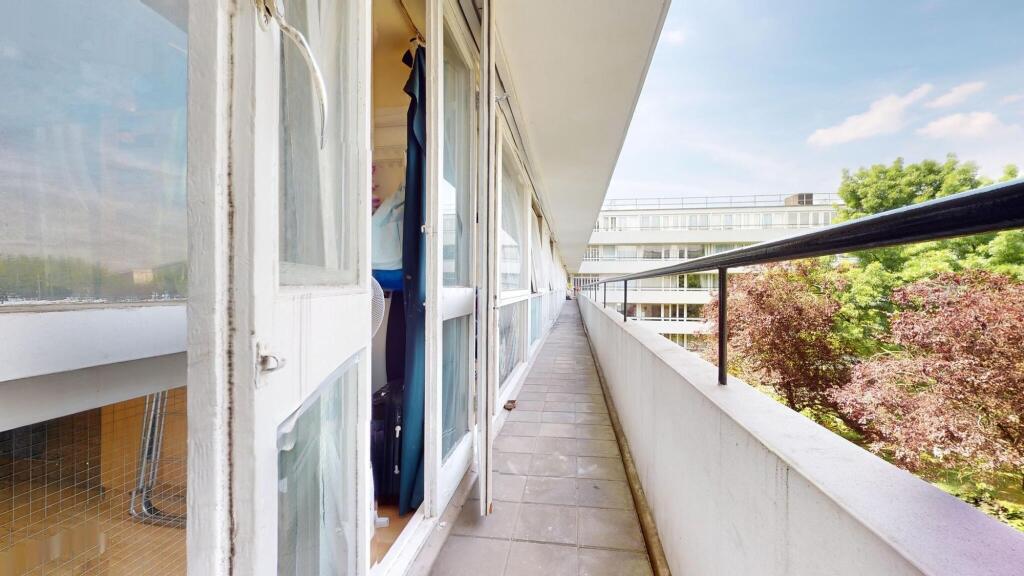 Bright exterior corridor of a residential prope...