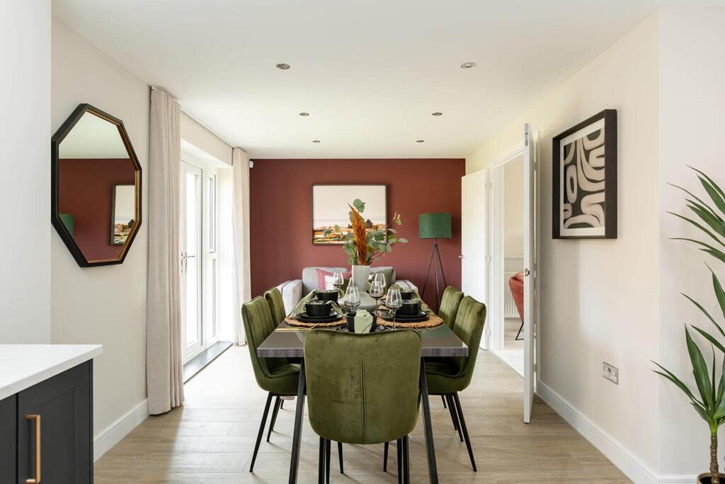 Double doors lead from the dining area to the garden, perfect for alfresco dining