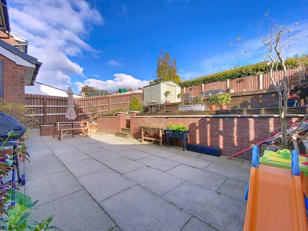 Rear patio and ga...