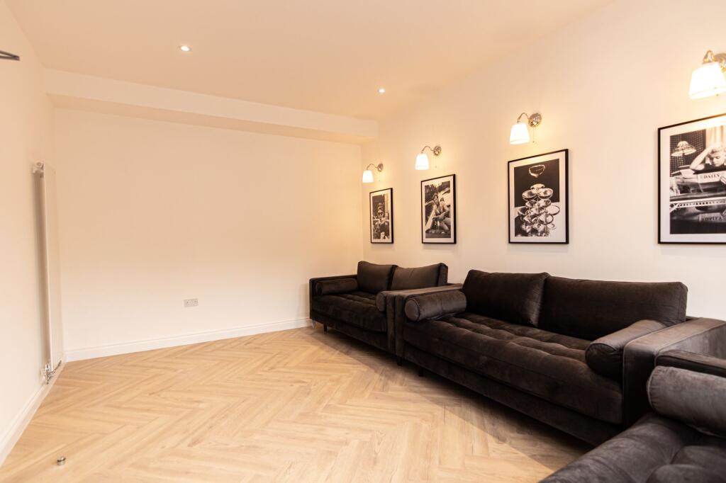 A spacious, modern living room with large sofas...