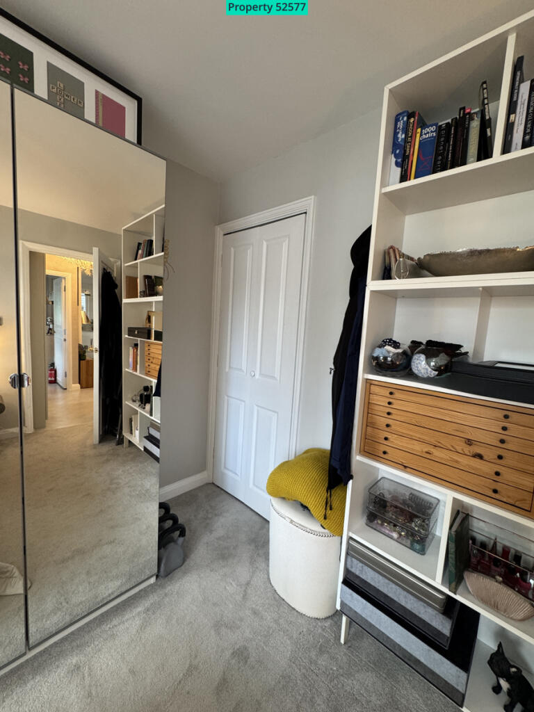 Master bedroom leading to walk in cupboard