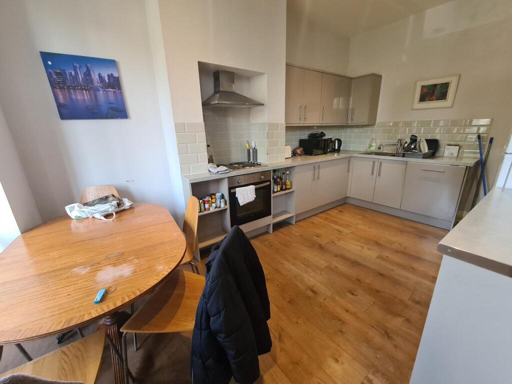 Bright and modern kitchen featuring ample count...