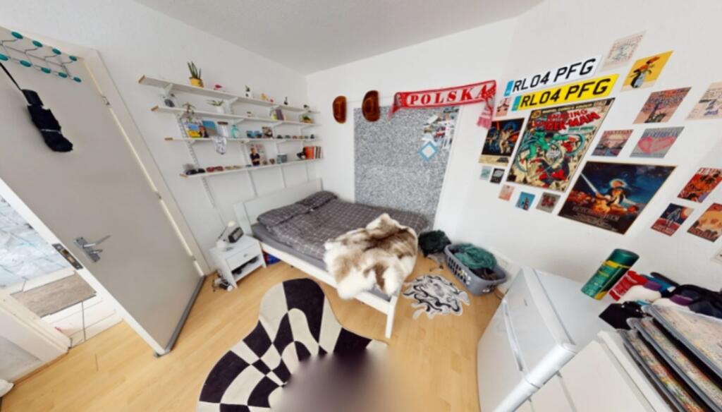 A cozy double bedroom featuring vibrant decor a...