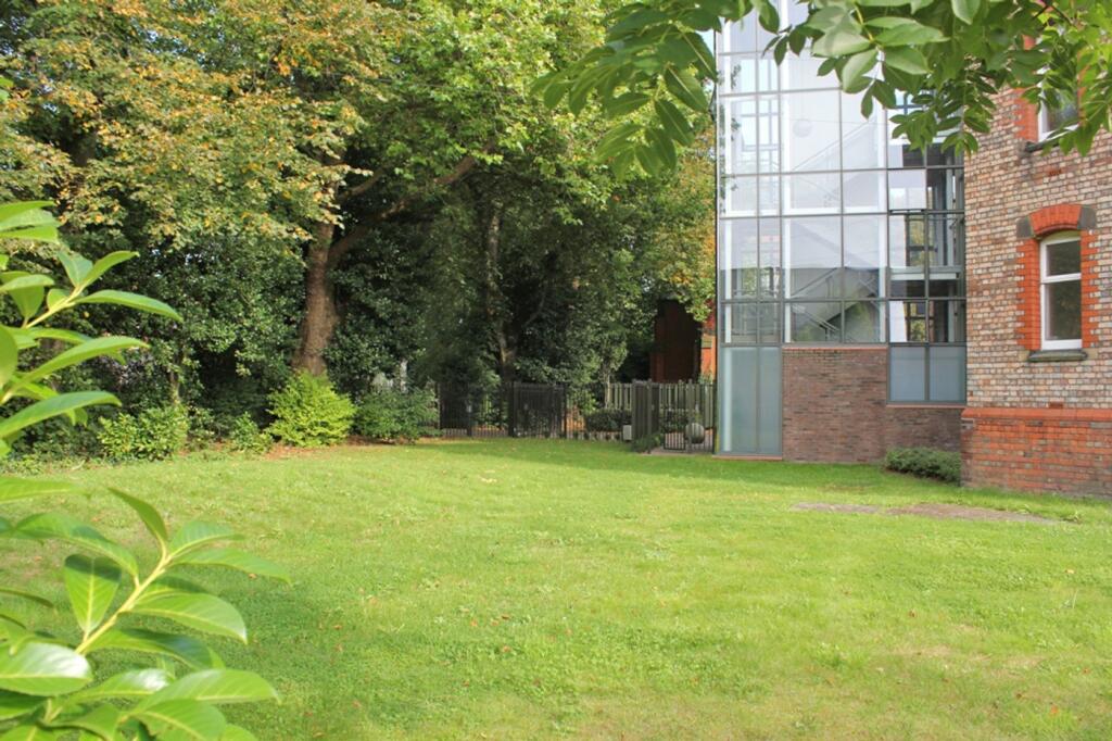 A spacious and well-maintained garden area, per...