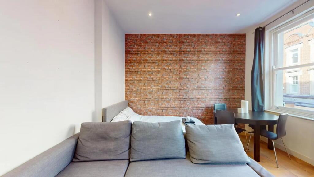 A modern double bedroom featuring a comfortable...