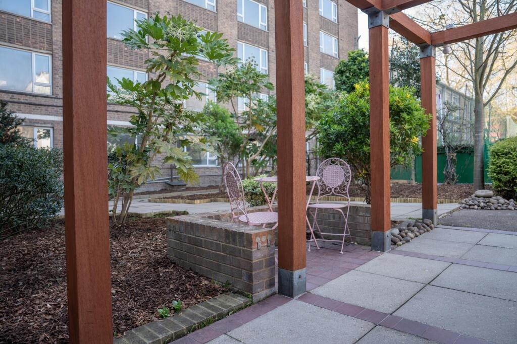 A beautifully maintained garden area featuring ...