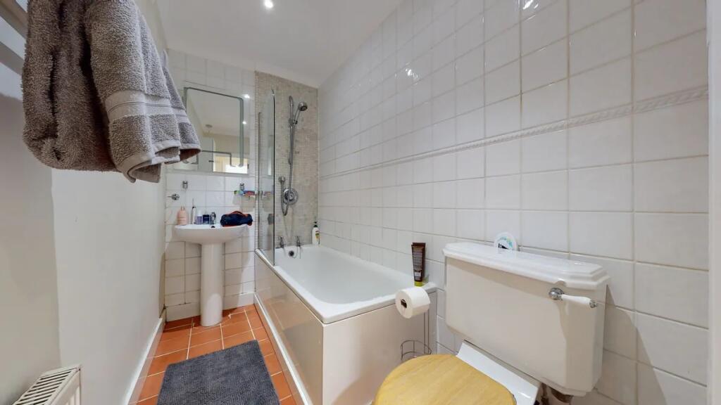 A clean and well-maintained bathroom featuring ...