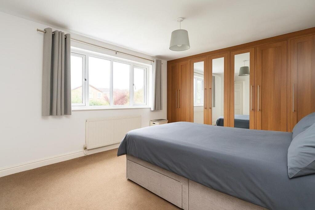 Spacious Bedroom with Natural Light.jpg