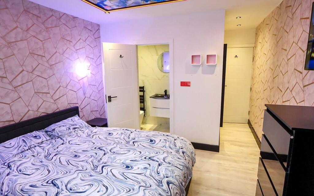A charming double bedroom featuring modern deco...