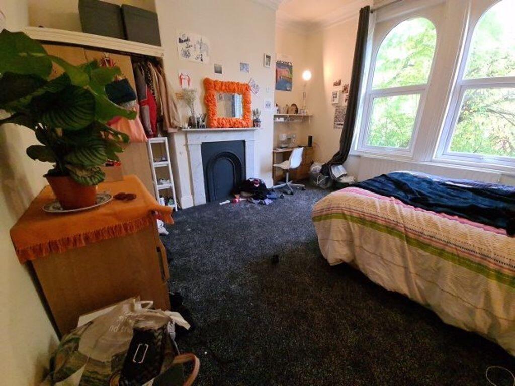 A cozy bedroom with natural light streaming thr...