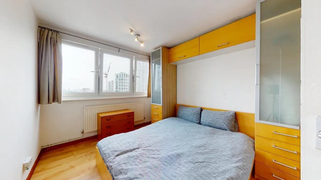Bright and neat double bedroom featuring a larg...