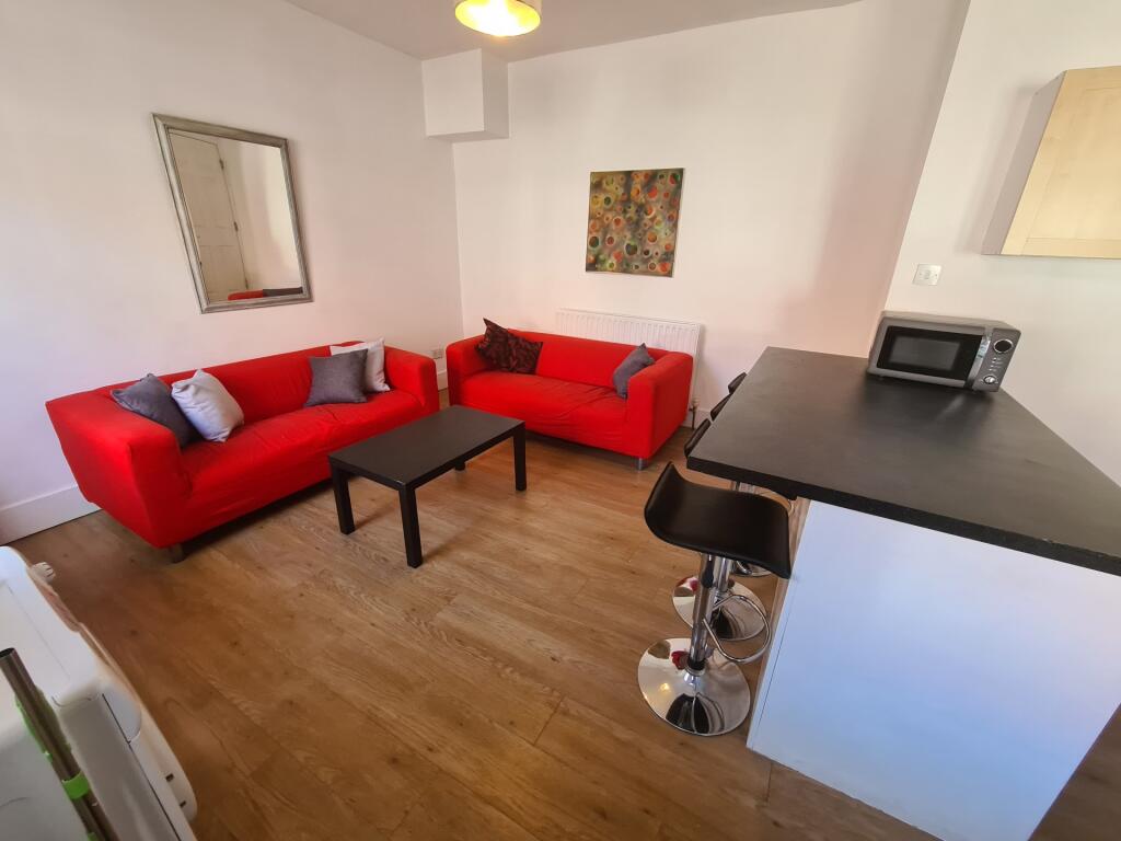 Bright and inviting living room featuring two v...
