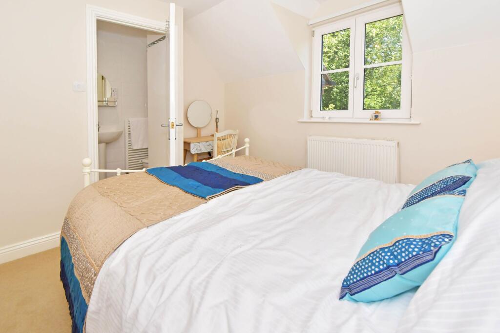 Bedroom two woth an en-suite shower room