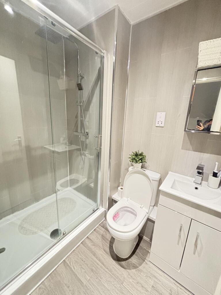 A modern and well-maintained bathroom featuring...