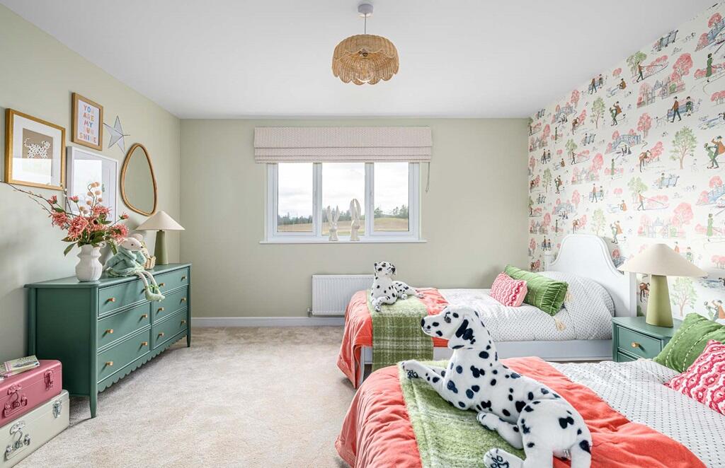 Bedroom 3 enjoys a view of the rear garden