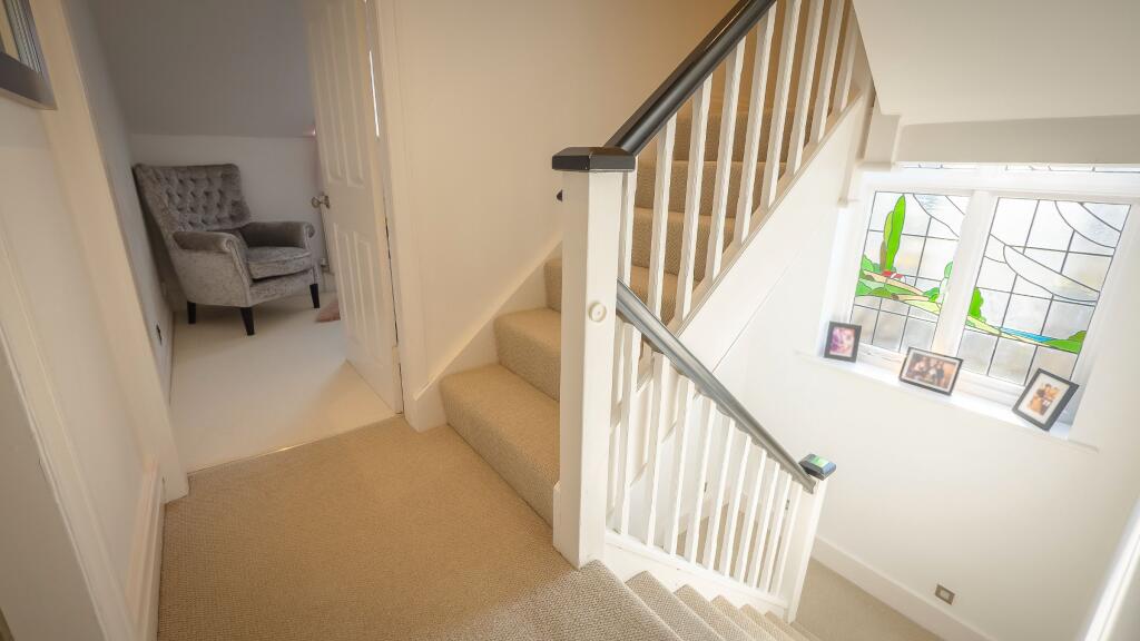 Landing and stairs to attic