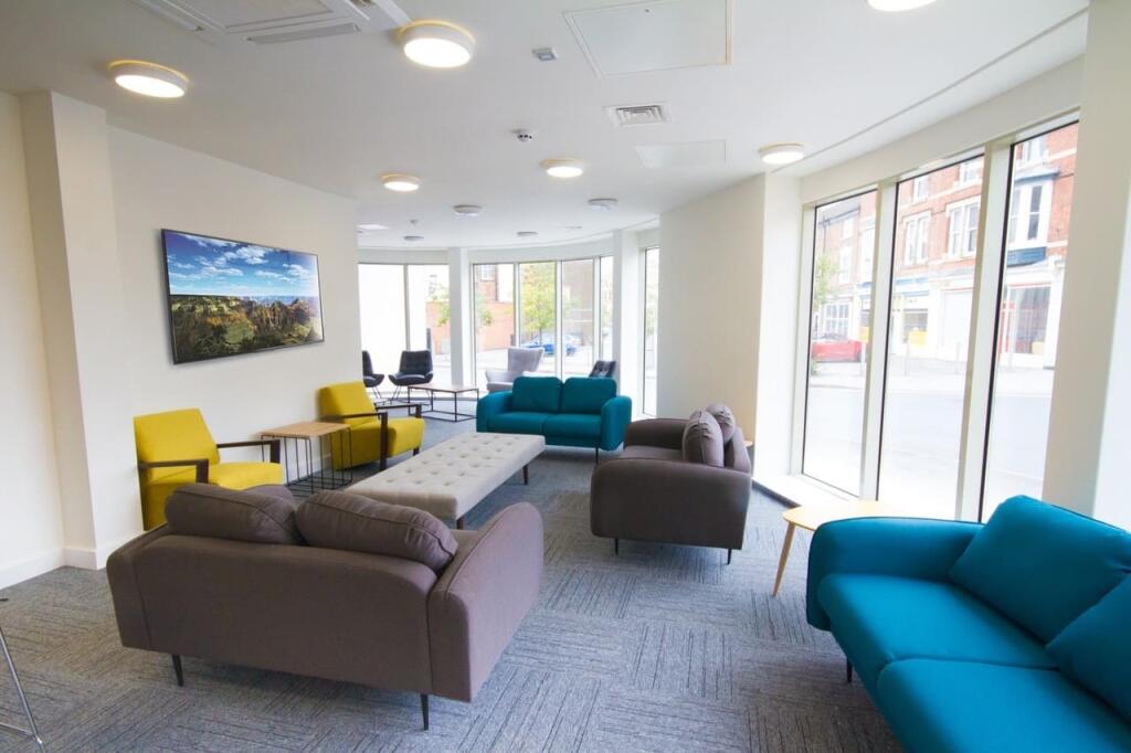 Bright and modern communal lounge featuring a v...
