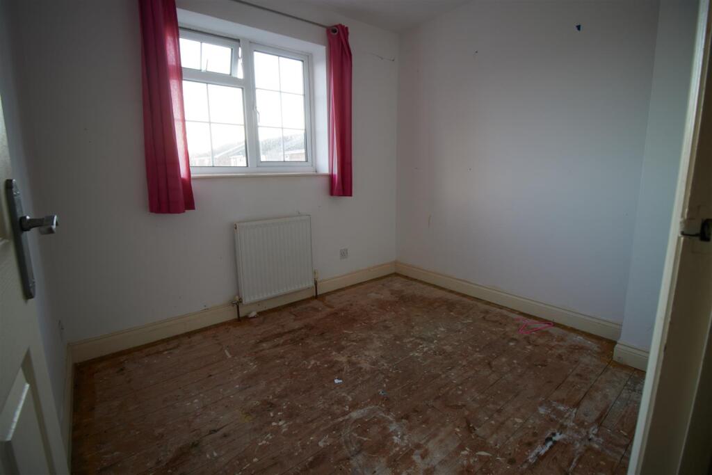 BEDROOM ONE TO FRONT
