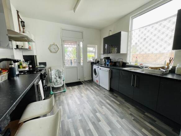 Bright and modern kitchen featuring sleek black...