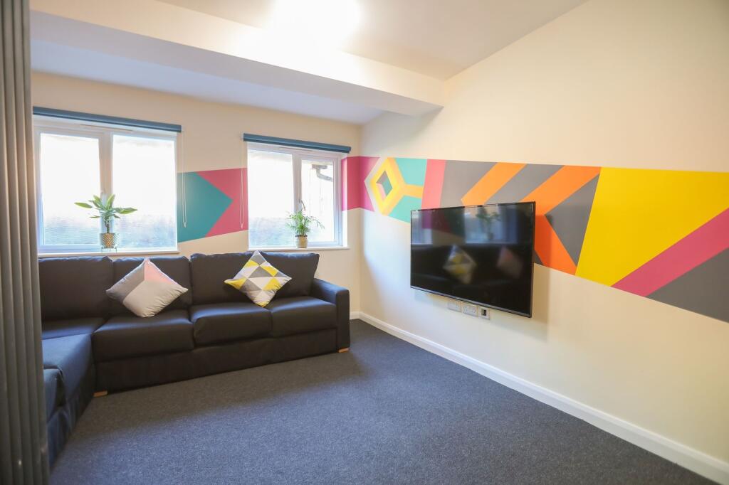 Experience a vibrant living room adorned with c...