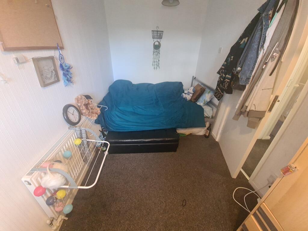 A compact and functional small room featuring a...
