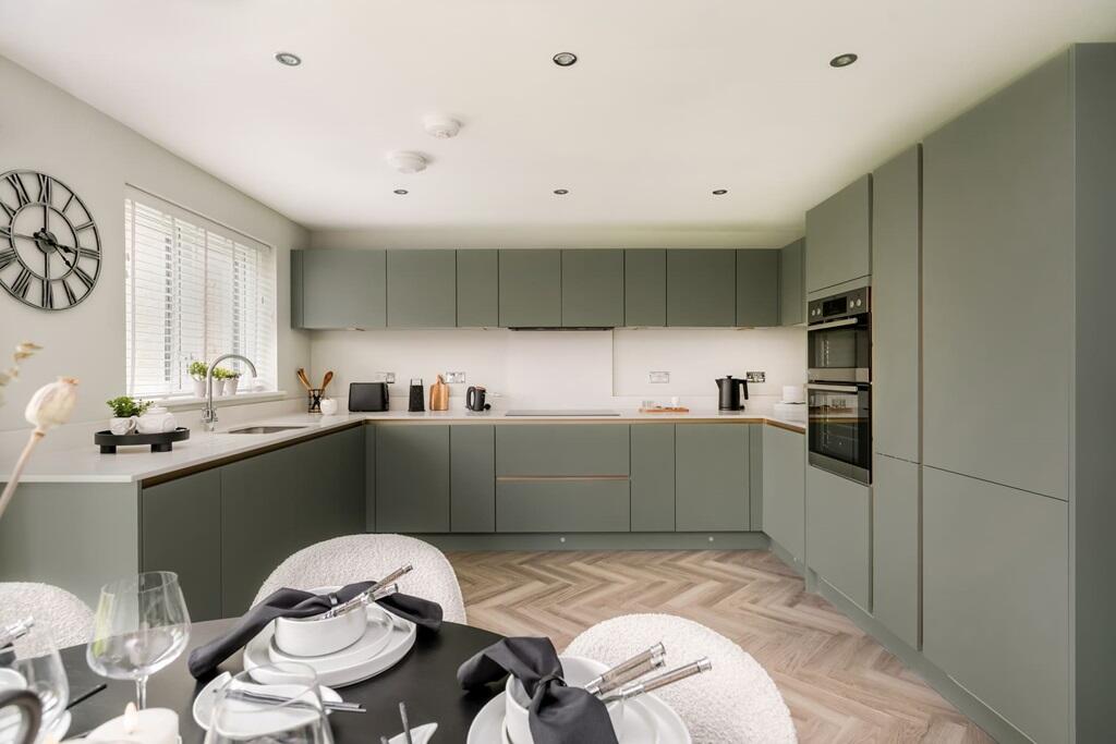 The large kitchen area has plenty of cooking space and units for storage