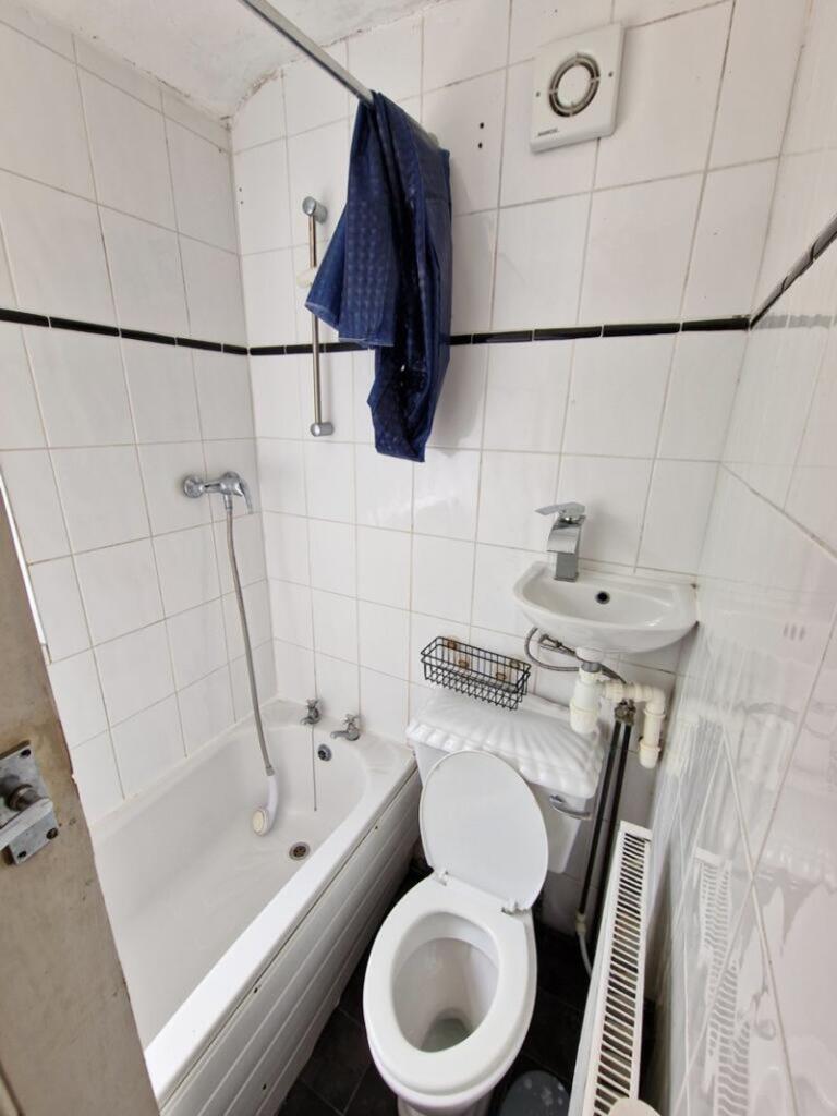 A functional bathroom featuring a bath and good...