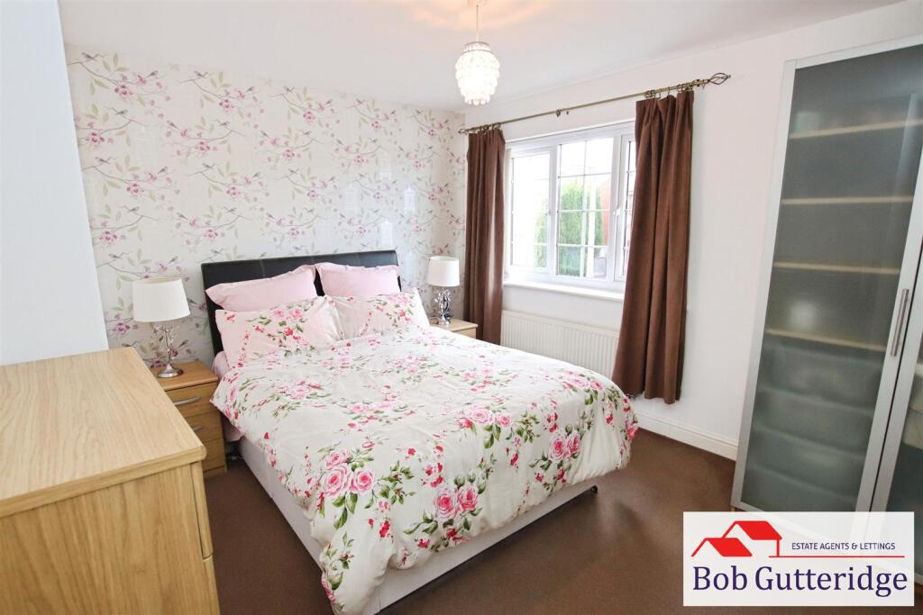 BEDROOM ONE (FRONT)
