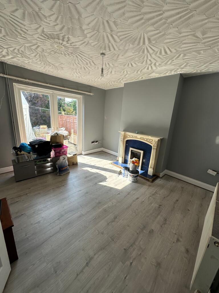 A bright and airy living room featuring light w...