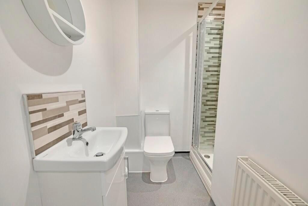 A modern and well-maintained bathroom featuring...