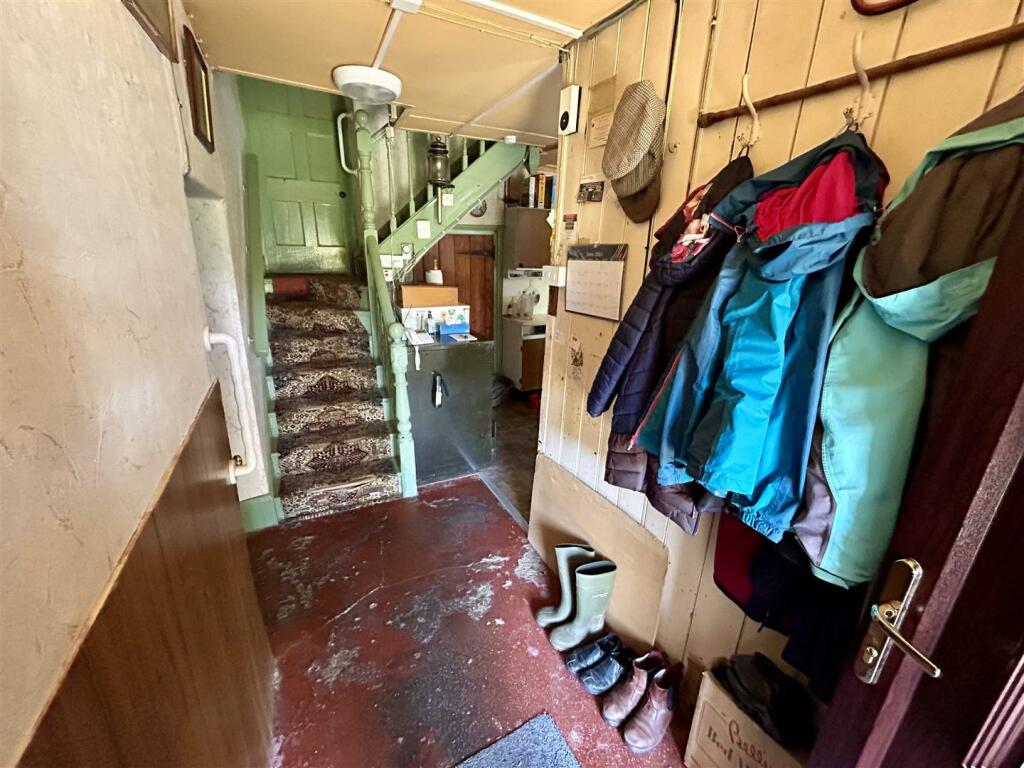 SIDE ENTRANCE DOOR leading to HALLWAY