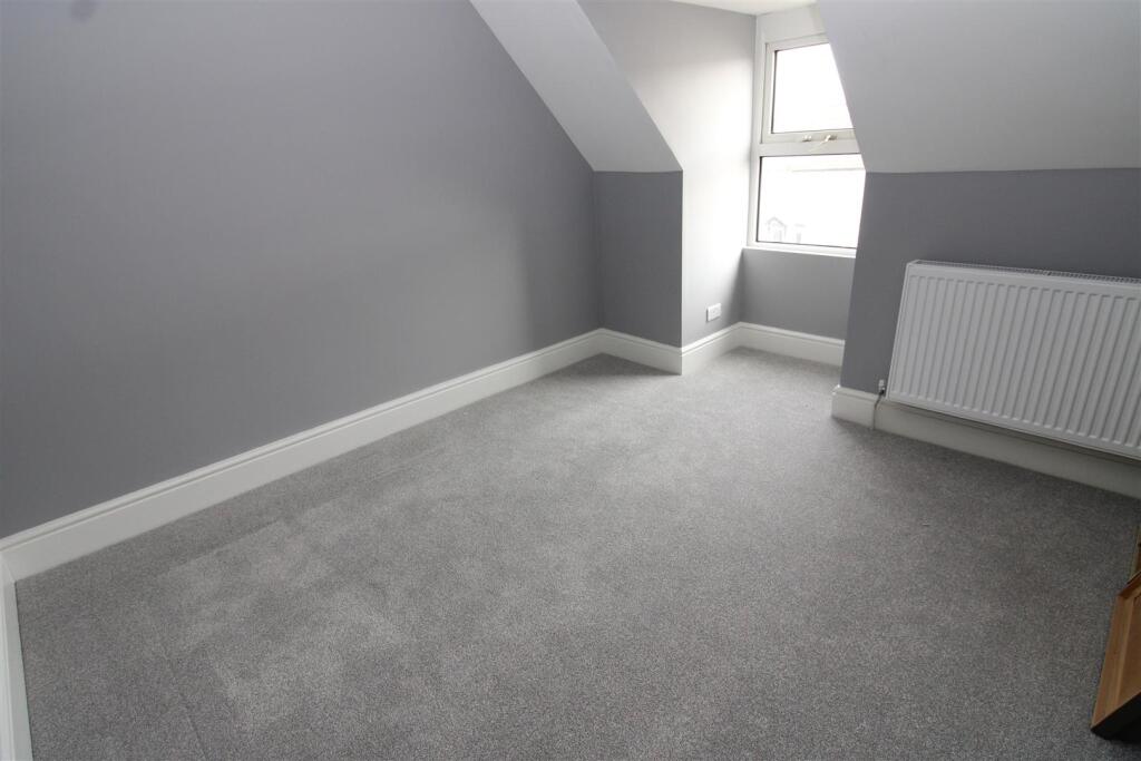 smaller bedroom top floor.JPG