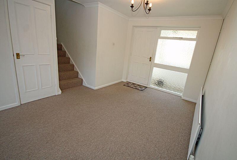 sitting room with stairs to first floor