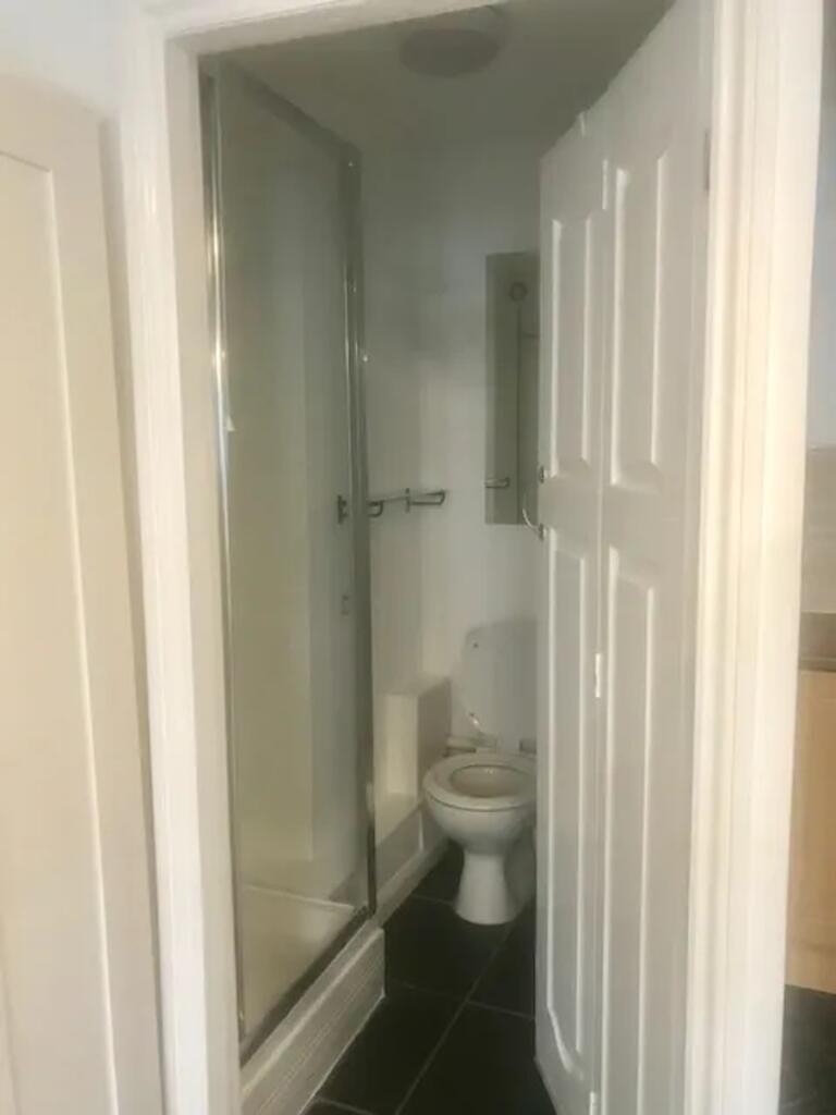 A clean and compact bathroom featuring modern f...