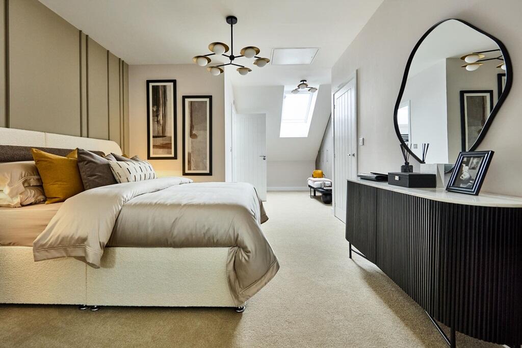 The spacious main bedroom occupies the second floor and boasts it's own dressing area