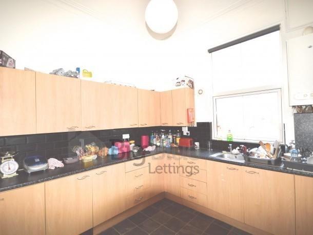 Bright kitchen with ample cabinetry and modern ...