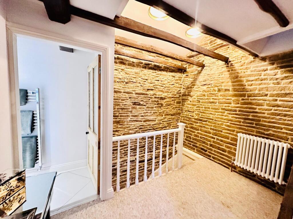 OPEN STAIRCASE TO THE FIRST FLOOR