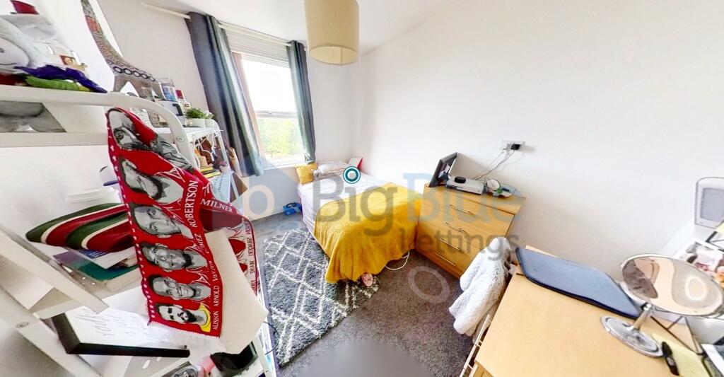 Bright and cozy single bedroom featuring a larg...