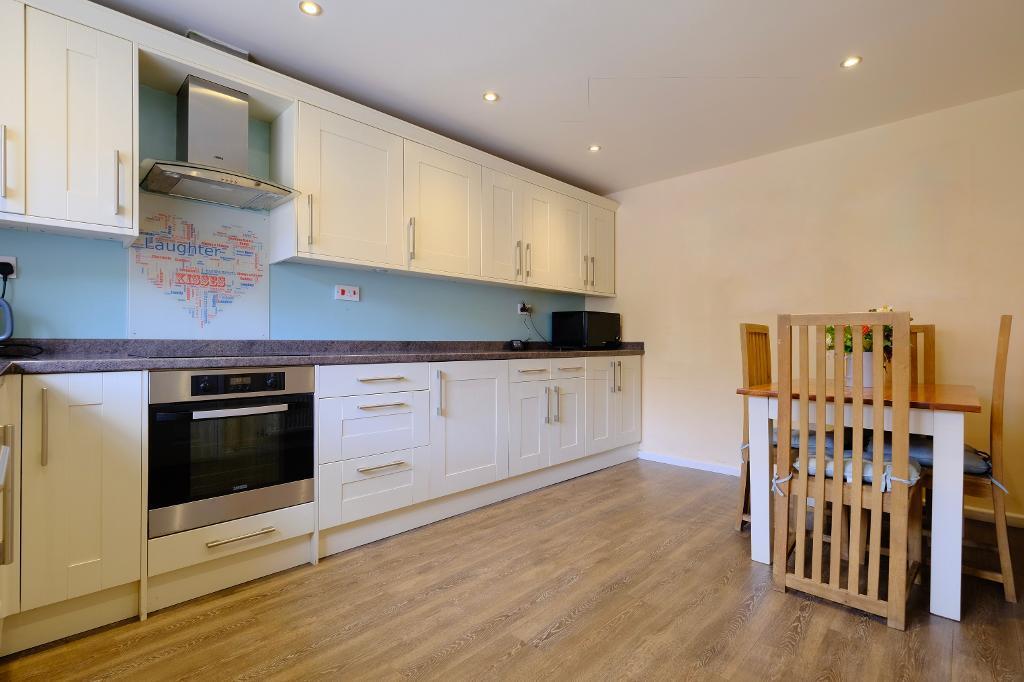 Fitted kitchen and space for large table