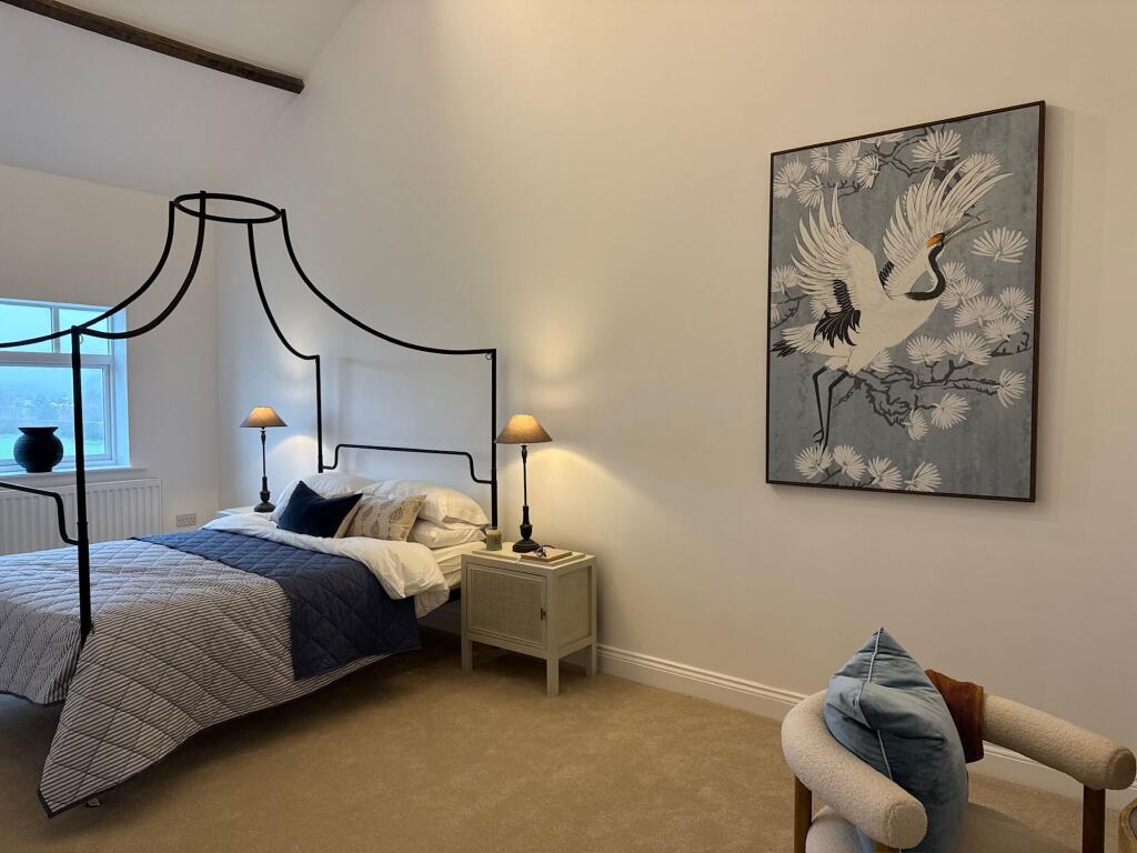 King sized bedroom with room for dressing area