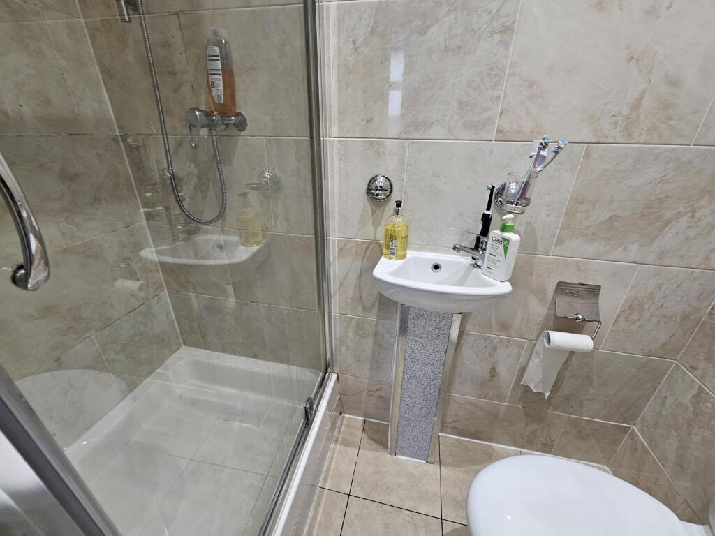 A clean and well-maintained bathroom featuring ...