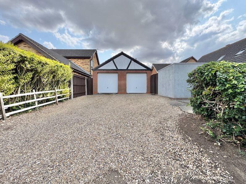 Detached double garage and parking