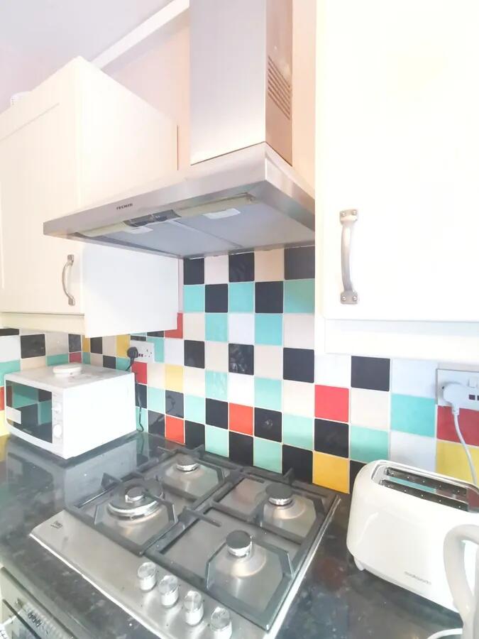 Bright and clean kitchen featuring a modern gas...